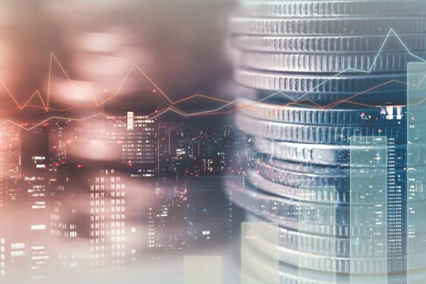 Double exposure of city and rows of coins for finance and banking concept